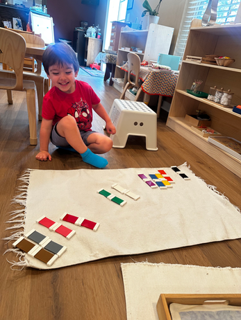 A child working with colorful learning materials