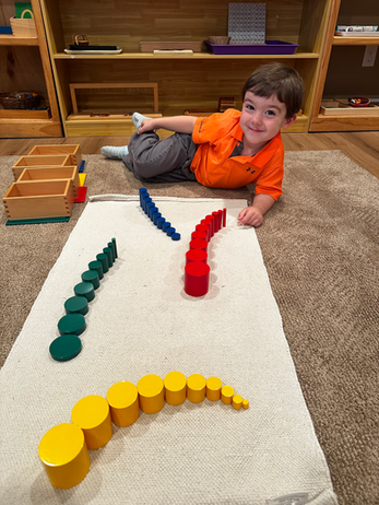 A child exploring colorful Montessori learning materials