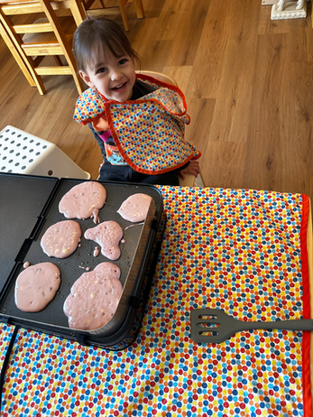 A child with a tray of prepared food